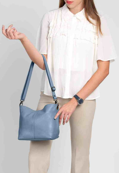 Lola Petite Dusky Blue Crossbody Italian Leather Handbag from LA LUPA / Model wears bag on arm