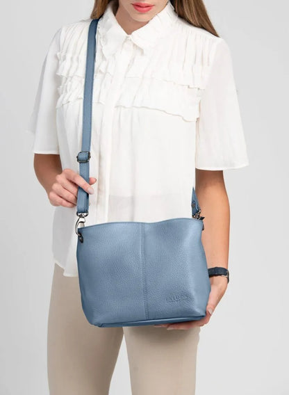 Lola Petite Dusky Blue Crossbody Italian Leather Handbag from LA LUPA / Model wears bag across body