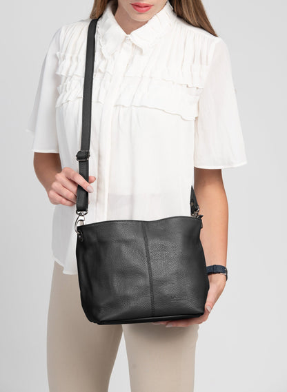 Lola Petite Black Crossbody Italian Leather Handbag from LA LUPA / Model wears bag across body