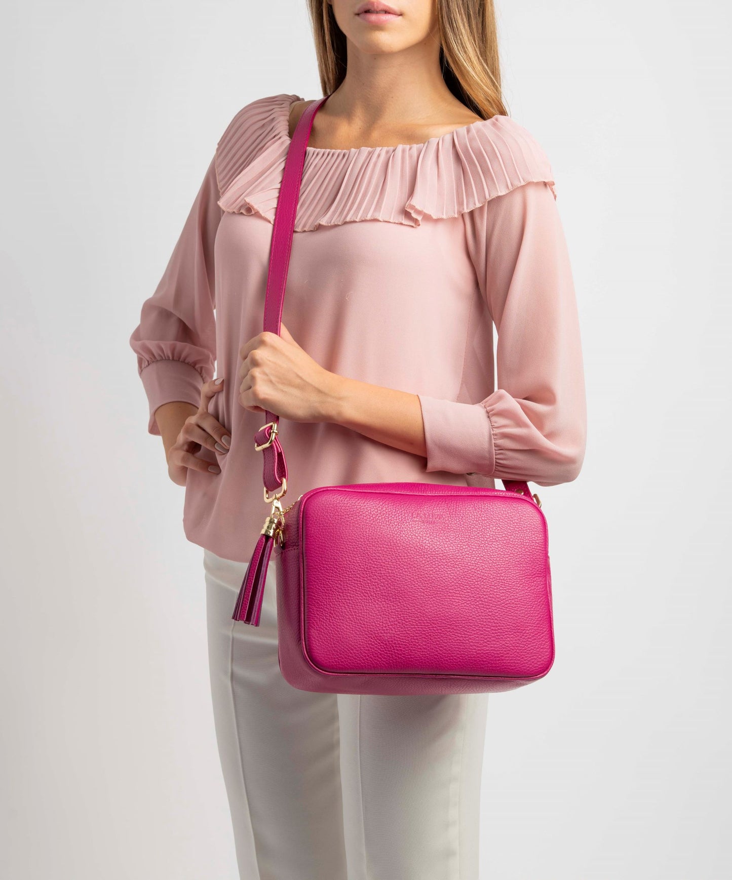 Allegra Fuschia Pink Crossbody Italian Leather Handbag by LA LUPA / Worn over model in cross body