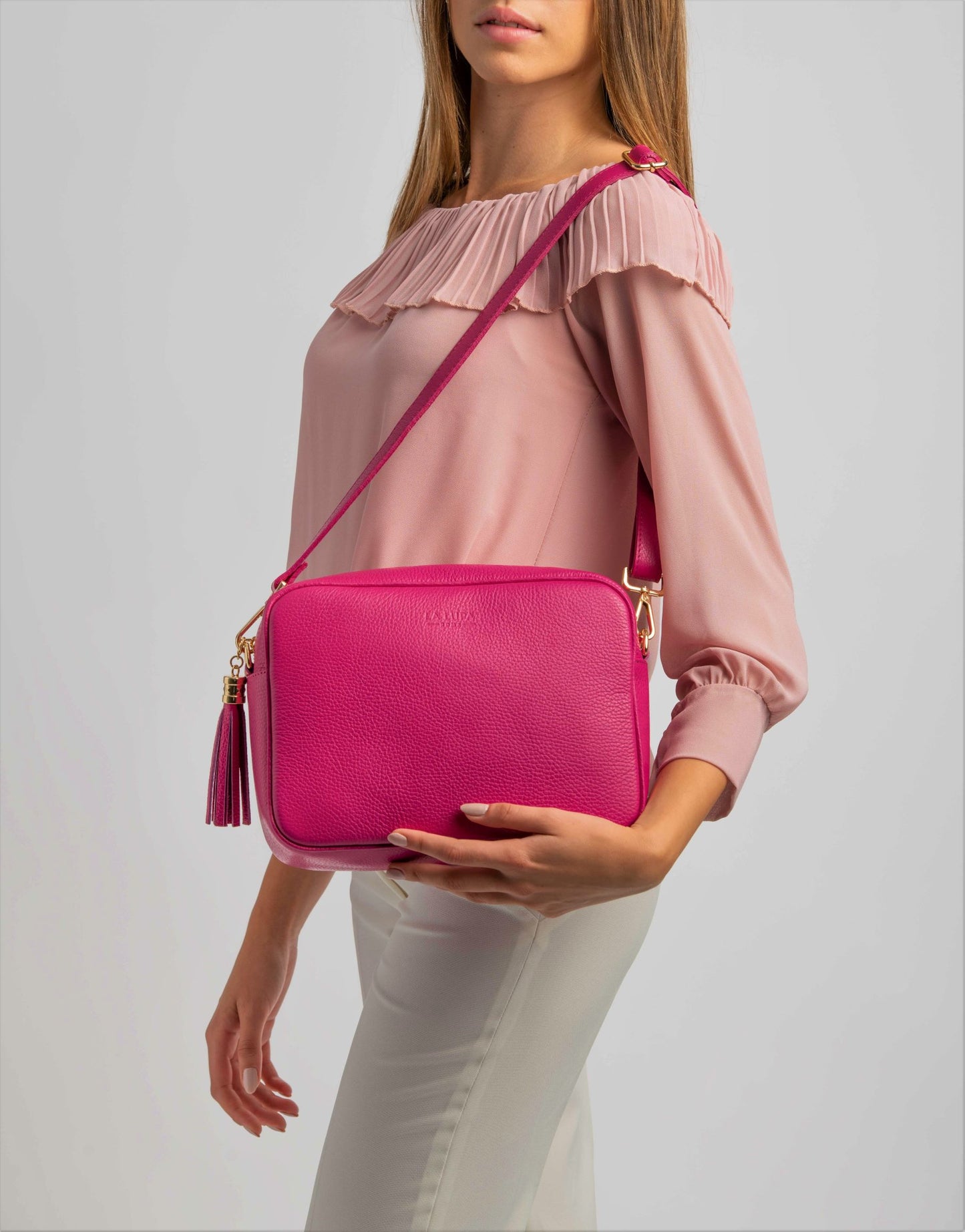 Allegra Fuschia Pink Crossbody Italian Leather Handbag by LA LUPA / Shows size compared to model