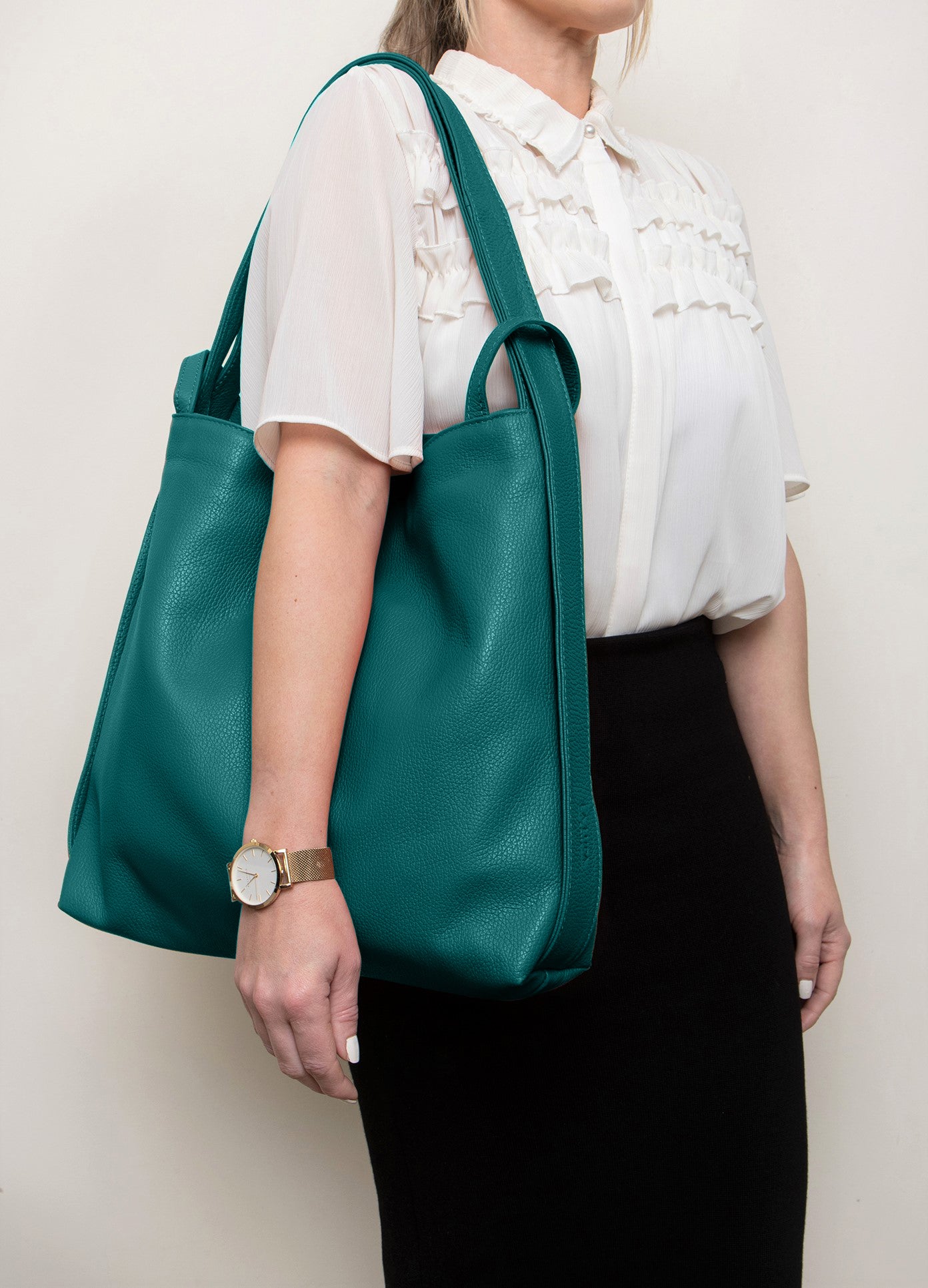 Bella 2-in-1 Teal Italian Leather Backpack and Tote by LA LUPA / Model wears as a tote bag