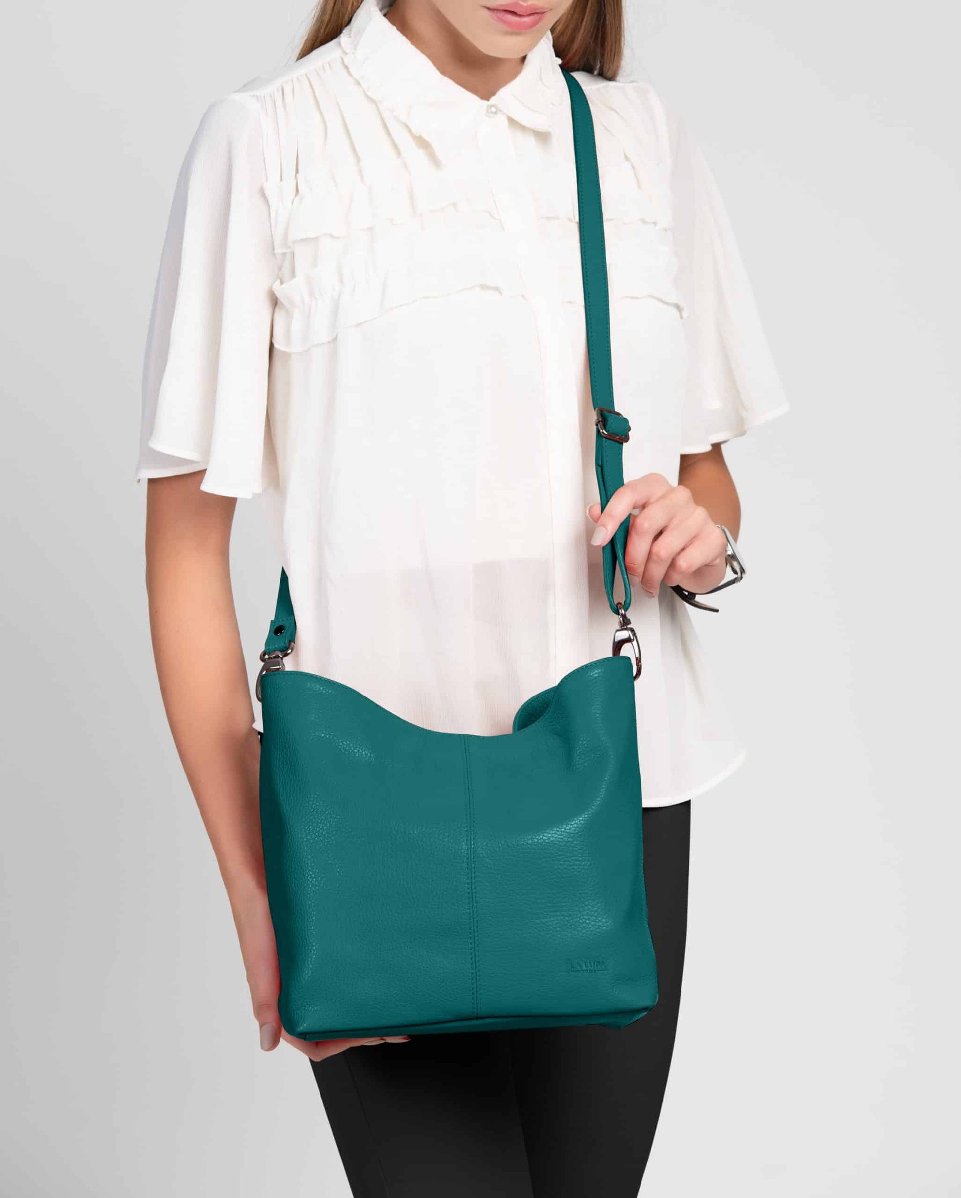 Lola Teal Crossbody Italian Leather Handbag from LA LUPA / Model wears bag across body