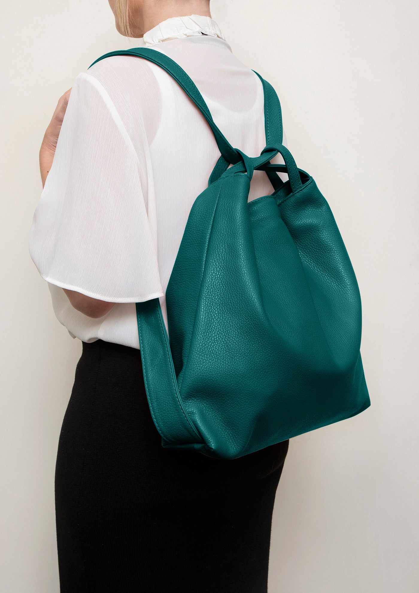 Bella 2-in-1 Teal Italian Leather Backpack and Tote by LA LUPA / Model wears as a backpack